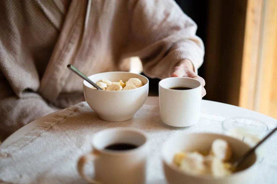 Breakfast and coffee prepared inside the warm timber cabin